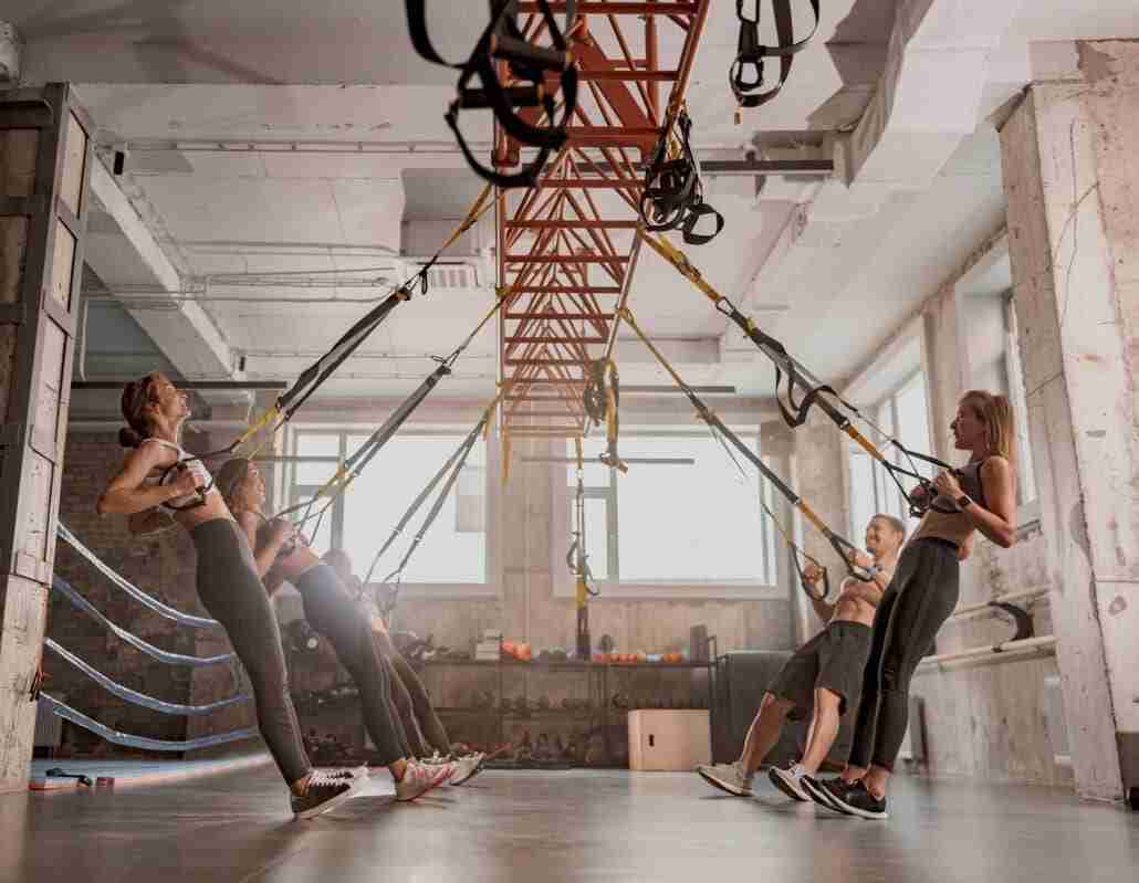 Athletic people doing crossfit krav maga training in gym warming up for Athletic people doing crossfit training in gym as warm up to krav maga and brazillian jiu jitsu